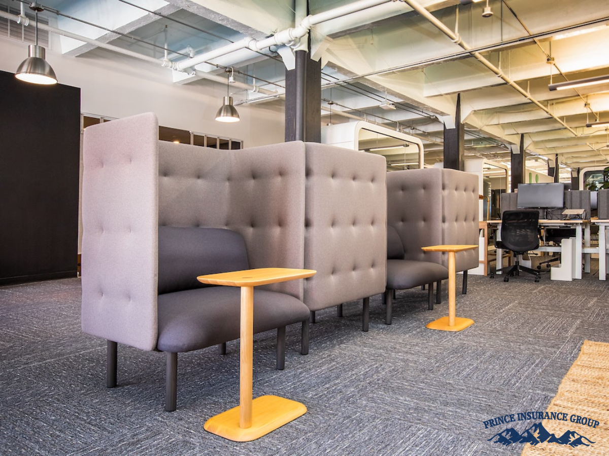 Modern office interior with desks and chairs, showcasing the importance of property insurance for commercial spaces