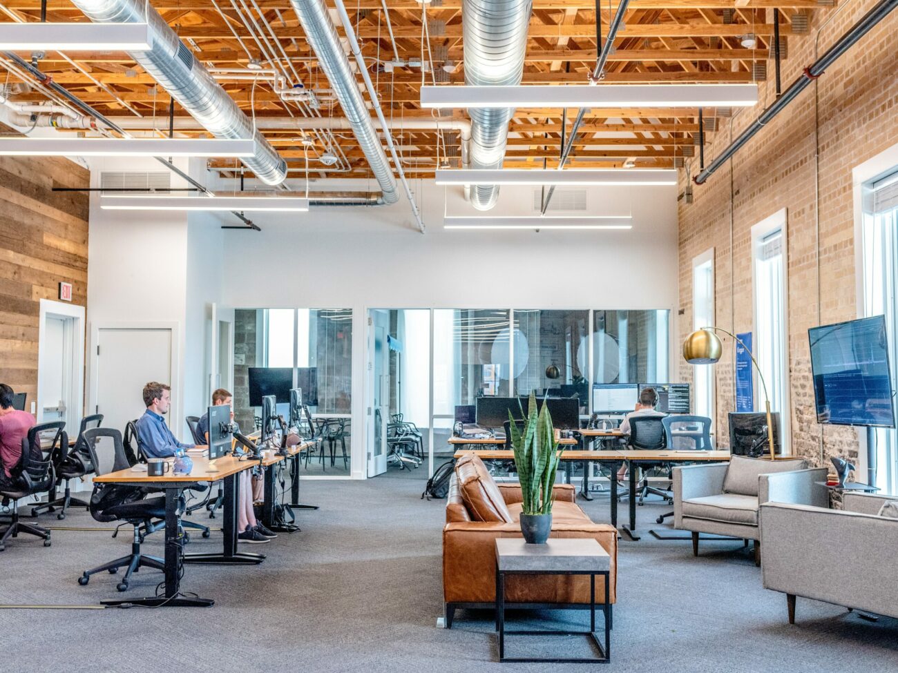 open office spaced filled with people working at their latops