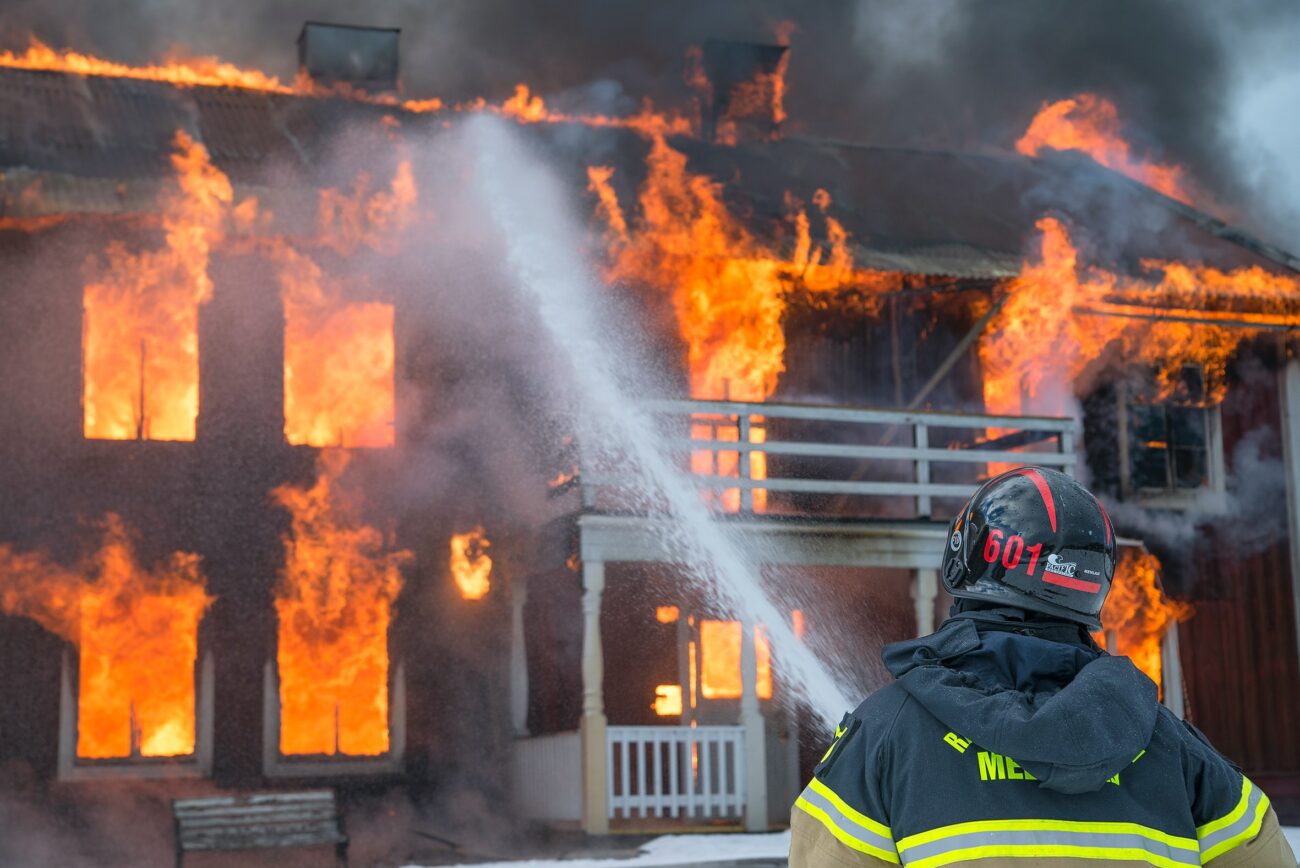 Firemen putting out a home fire.