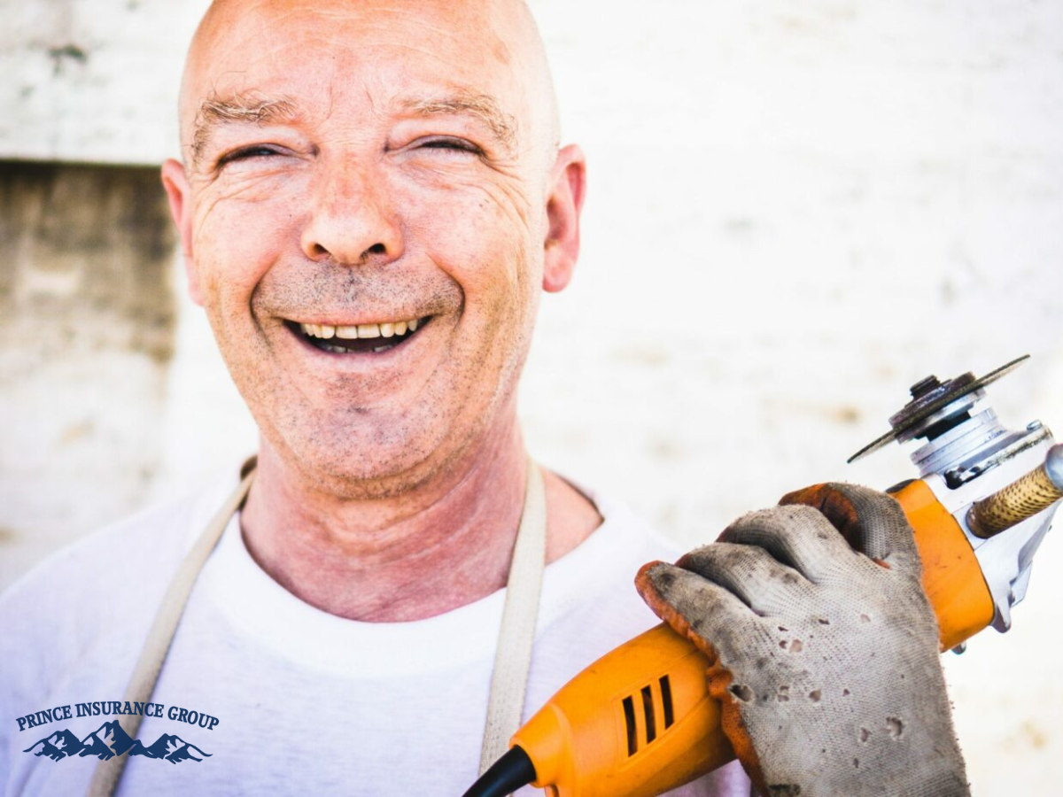 man holding a saw smiling