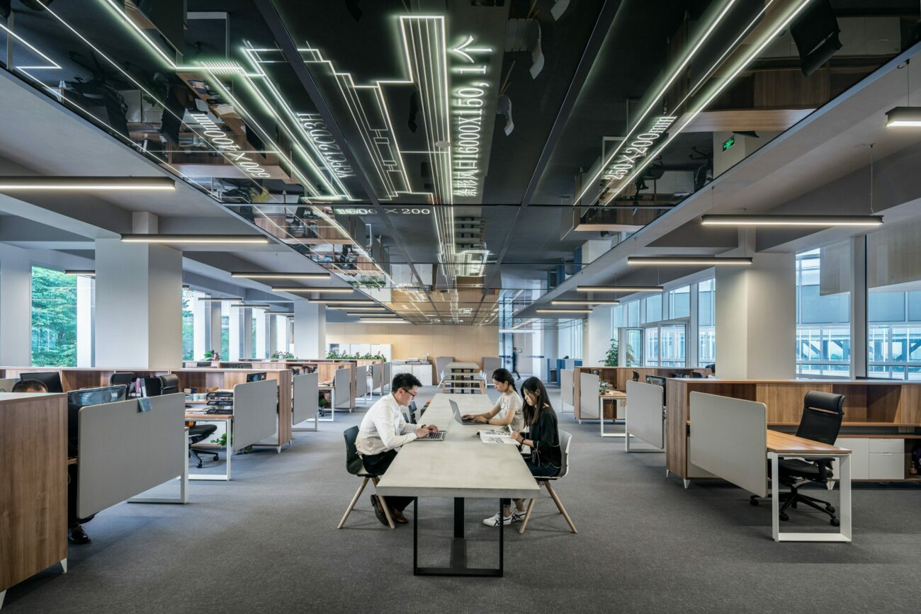 open office space with a long working table in the middle