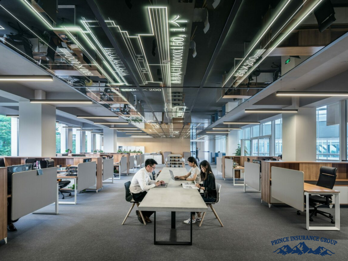 open office space with a long working table in the middle