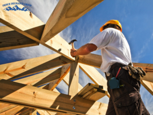 A Colorado construction site with workers and equipment, illustrating coverage protection under Home Builders Insurance.
