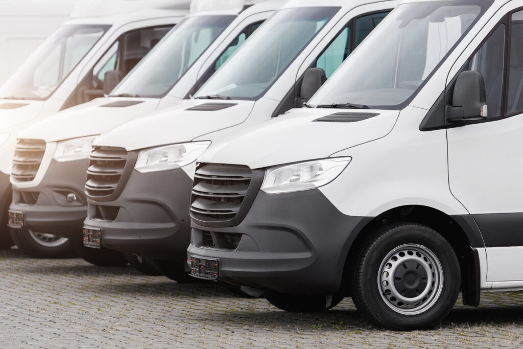 Parked commercial vehicles representing Commercial Auto Insurance coverage for business fleets, showcasing company trucks and vans protected for daily operations.