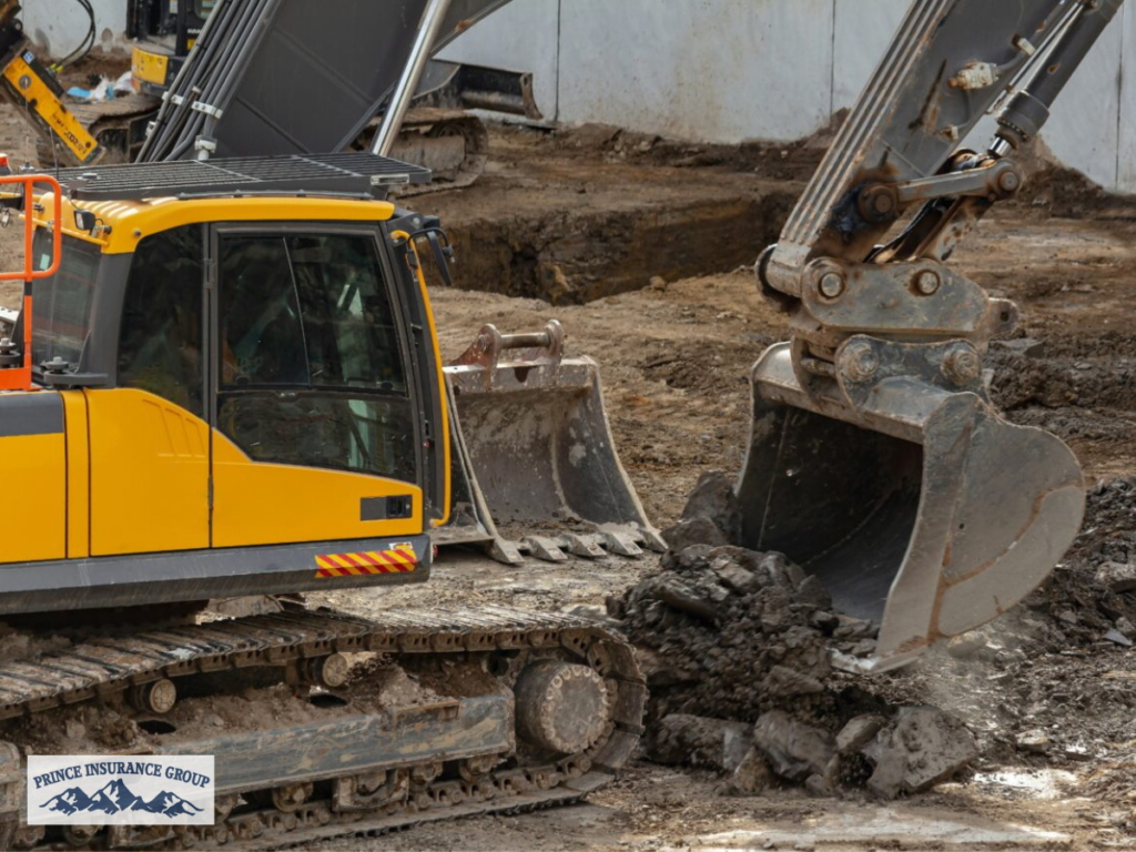 Excavators working at an active construction site, highlighting the importance of Excavation Contractor Insurance for protecting heavy equipment and excavation operations.
